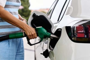 Single Mom putting Gas in her only vehicle.
