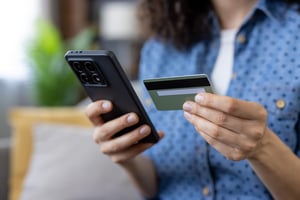 Person checking bank account securely on phone  