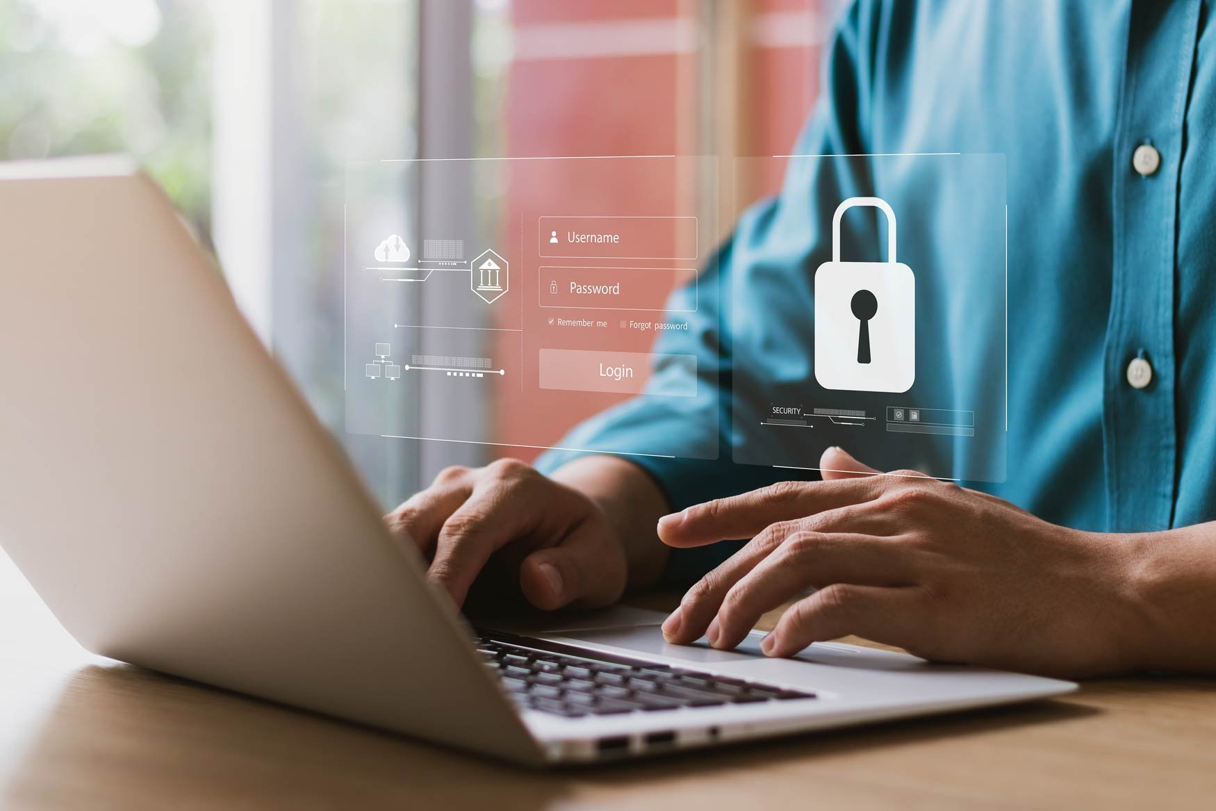 A closeup photo of a person’s hands working on a laptop. Superimposed is a transparent image showing typical login credentials and a big padlock symbol. 